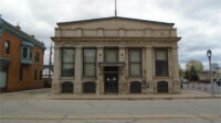 The former Marshall & Ilsley Bank, 411 W. National Ave., is being redeveloped as the headquarters for Roofed Right America LLC.
