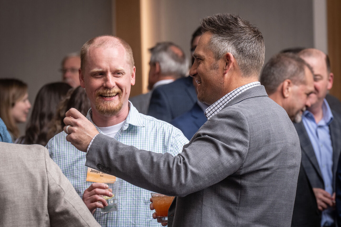 Joseph Schobe of The Boldt Co. (left) and Eric Harrmann of AG Architecture share a laugh during the networking portion of the event.